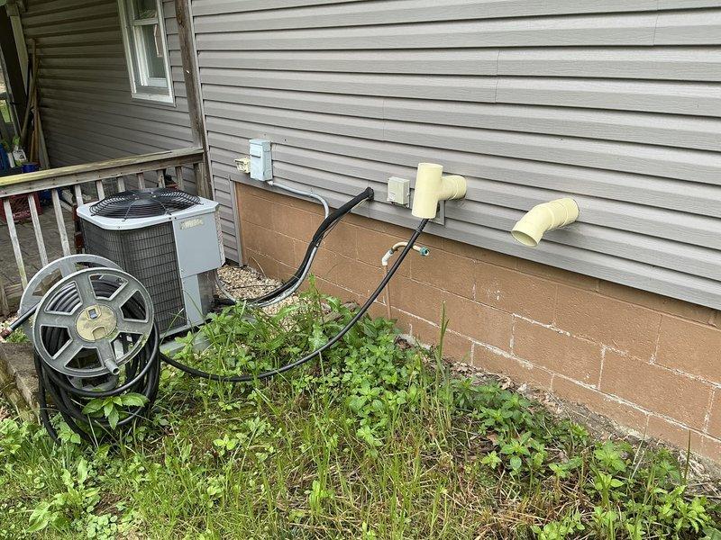 Conducted estimate for HVAC system replacement at residential property with 32-year-old Comfortmaker EnviroPlus80 furnace and existing outdoor AC condenser units. Previous AC replacement included only the outdoor unit, leaving aging furnace in service. Evaluated current equipment configuration including furnace, ductwork connections, and dual outdoor condensers positioned along exterior foundation. Provided comprehensive replacement quote covering furnace repair and system upgrade options to address equipment age and compatibility concerns with existing outdoor components.