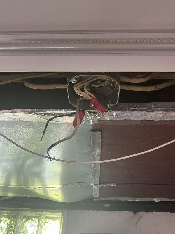 Responded to no power condition in basement room with no tripped breakers. Upon inspection, discovered improper DIY wiring installation in ceiling cavity near HVAC equipment. Located loose wire connections in junction box concealed above ductwork between floor joists. Secured all wire terminations, verified proper wire sizing and routing per NEC standards, and restored power to affected circuit. Tested all outlets and lighting in basement room to confirm full functionality. Recommended future evaluation of entire basement electrical system due to non-professional installation methods observed.