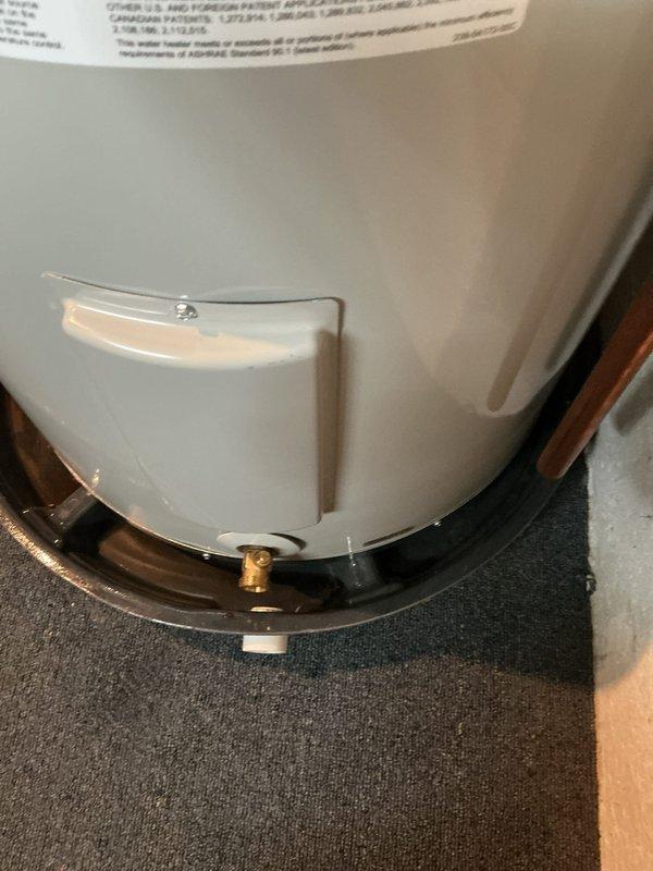 Replaced 40-gallon electric water heater in basement utility area. Unit was installed with proper copper piping connections, including sediment trap and pressure relief valve, and positioned on existing platform over carpeted surface. All plumbing connections were secured with appropriate fittings, and system was tested for proper operation upon completion.