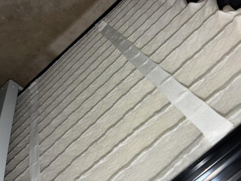 Completed annual maintenance on 13-year-old air conditioning system. Inspected electrical control panel, capacitor, and wiring connections; noted aging components with accumulated dirt and debris throughout assembly. Verified air filter condition, which showed minimal debris accumulation with pleated media intact and functioning properly.