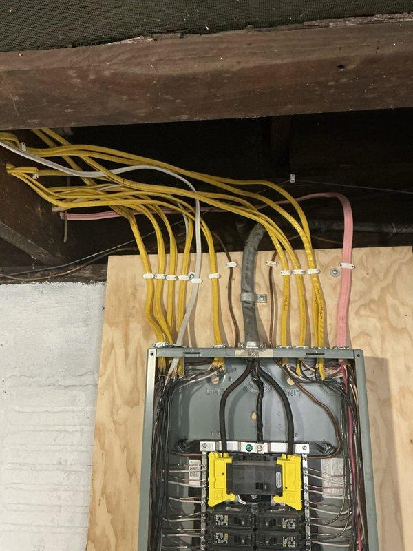 Completed installation of 480V AC circuit with new electrical panel and wiring. Installed circuit breakers, surge protection components, and properly terminated all conductors entering the panel from overhead conduit runs. Verified proper amperage readings using clamp meter to ensure circuit is functioning correctly and within specifications.