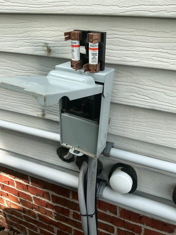 Completed preventative maintenance cooling visit on Lennox HVAC system with indoor unit located in basement and outdoor disconnect at exterior. Inspected condensate drain lines, electrical disconnect with fuses, and verified system operation. Unit is under 5 years old and operating within normal parameters.