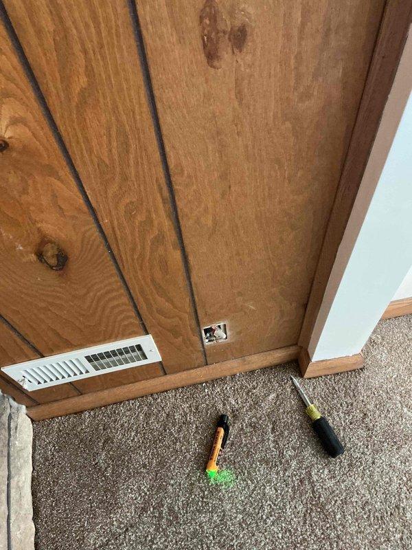 Installed new electrical outlet in residential space per customer request. Accessed ceiling cavity through crawl space to run electrical wiring from existing circuit to new outlet location. Routed cable through wooden joists alongside existing HVAC ductwork and plumbing infrastructure. Mounted outlet box in wooden ceiling near wall junction, made proper electrical connections, and secured outlet to code specifications. Verified circuit functionality and proper grounding upon completion.