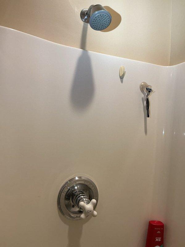 Responded to water leak complaint and performed diagnostic inspection of copper refrigerator supply line. Located active leak at connection point and assessed condition of existing saddle valve and shut-off valve assembly. Provided customer with repair options and quote for replacement saddle valve and shut-off valve installation to resolve leak and prevent future failures.