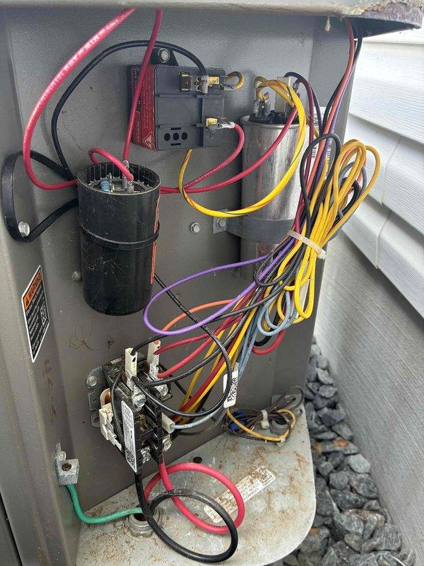 Completed preventive maintenance on 7-year-old residential air conditioning system. Inspected electrical disconnect panel, verifying all connections, contactor operation, and capacitor condition. Cleaned condenser coil fins and confirmed proper airflow through heat exchanger. All components operating within normal parameters upon completion of service.