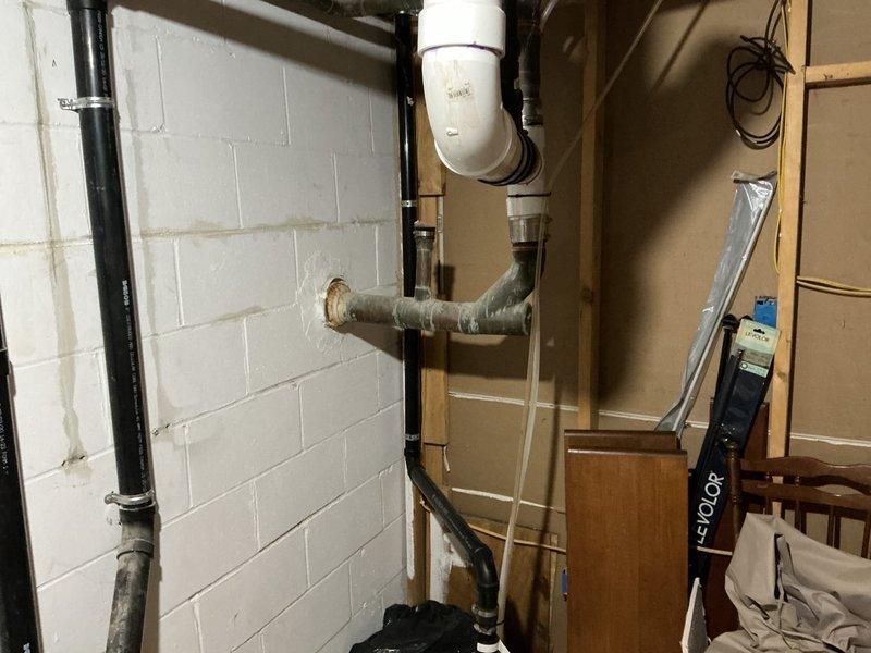 Completed preventative maintenance service including comprehensive whole-home plumbing inspection and water heater flush on Bradford White tanked unit located in basement utility area. Performed systematic drain and flush procedure to remove sediment buildup from tank, inspected all visible copper supply lines, compression fittings, and shutoff valves for proper operation and signs of corrosion or leaks. Verified temperature and pressure relief valve functionality, examined anode rod condition, and confirmed proper venting through insulated ductwork. Inspected exposed plumbing throughout mechanical room including vertical black iron drain lines and PVC drainage systems for structural integrity. All components found operating within normal parameters with no immediate concerns identified; unit refilled and returned to service with no issues noted.