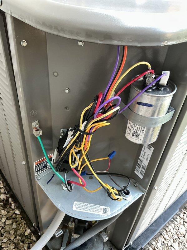 Completed preventative maintenance inspection on one-year-old outdoor air conditioning system. Accessed electrical compartment and inspected all internal components including capacitor, control board, wiring connections, and grounding system. Verified proper operation of outdoor disconnect box and fuse assembly. All electrical connections found secure, capacitor tested within normal parameters, and system components operating as designed. Unit confirmed ready for cooling season.