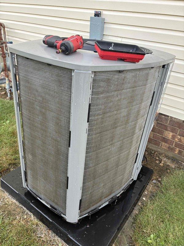 Completed MVP annual air conditioning maintenance on residential outdoor condensing unit approximately two years old. Performed comprehensive system inspection including visual examination of cabinet panels, protective screening, and refrigerant line connections. Verified proper unit placement on isolation pad and confirmed electrical disconnect box accessibility. Checked condensate drainage system and placed overflow pan for monitoring. All components found to be in serviceable condition with screening material intact and unit operating within normal parameters. Discussed service agreement renewal options and clarified warranty coverage details with homeowner.