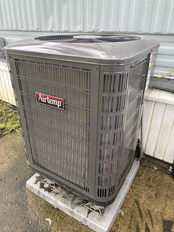 Completed routine maintenance visit on 2-year-old Airtemp heat pump system under MVP recurring service agreement. Performed standard cooling season inspection of outdoor condensing unit and indoor evaporator coil, documenting equipment condition with photographs. Unit operational at time of service with no immediate repairs required.