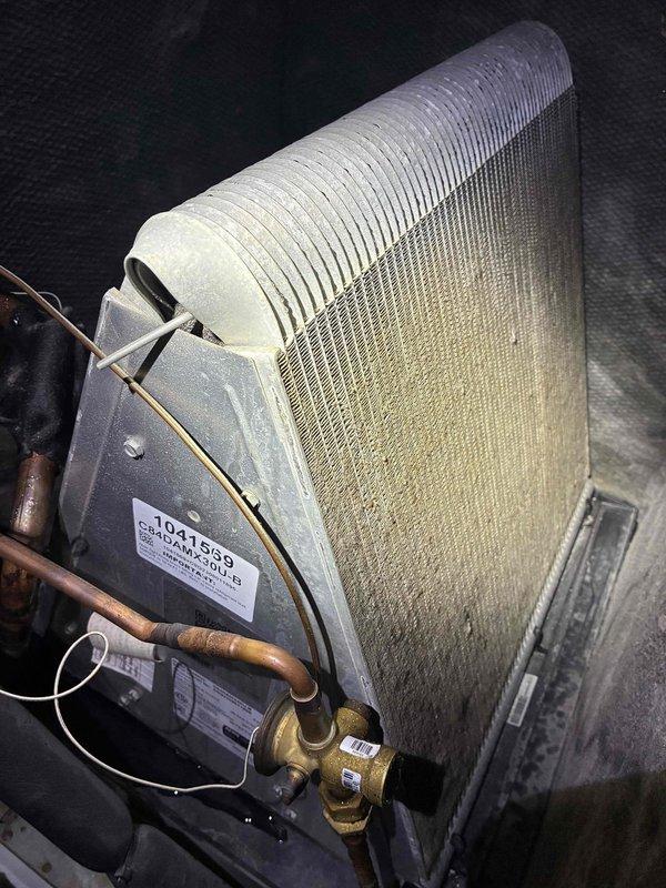 Completed routine maintenance visit on 2-year-old Airtemp heat pump system under MVP recurring service agreement. Performed standard cooling season inspection of outdoor condensing unit and indoor evaporator coil, documenting equipment condition with photographs. Unit operational at time of service with no immediate repairs required.