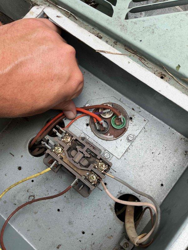 Responded to no cooling complaint on 34-year-old residential air conditioning system. Upon arrival, performed diagnostic inspection of outdoor condensing unit and electrical components. Unit showed significant age-related deterioration including corroded terminal connections, weathered wiring, and oxidized metal surfaces on the electrical junction area. The aging mint green condenser exhibited extensive wear consistent with three decades of outdoor exposure. After thorough evaluation of the electrical connections, compressor, and overall system condition, presented findings to customer. Due to the advanced age of the equipment and extent of component degradation, recommended system replacement rather than repair. Customer declined further service at this time.