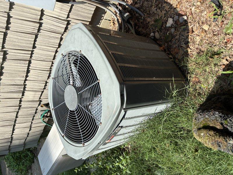 Responded to no cooling complaint on 15-year-old residential air conditioning system. Upon arrival, performed diagnostic inspection of outdoor condensing unit. Visual examination revealed severely corroded electrical connections at the contactor assembly, with heavy green copper oxidation and white crystalline deposits on wire terminals indicating prolonged moisture exposure. The deteriorated wiring and terminal connections were preventing proper electrical flow to the compressor and fan motor. Unit exterior showed significant weathering consistent with age, and heat exchanger coils displayed discoloration from years of outdoor exposure. Documented extensive corrosion damage with photographs for customer records. Advised customer that the electrical component failure due to corrosion was the root cause of system malfunction and provided recommendations for necessary repairs to restore cooling operation.