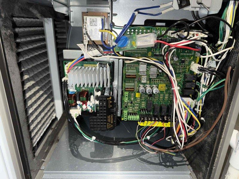 Completed routine maintenance on a 2-year-old air conditioning system. Performed comprehensive inspection of control board components, including DIP switch configurations, circuit connections, and wiring harnesses. All electronic components, terminal blocks, and control modules were found to be in proper working condition with no adjustments required.
