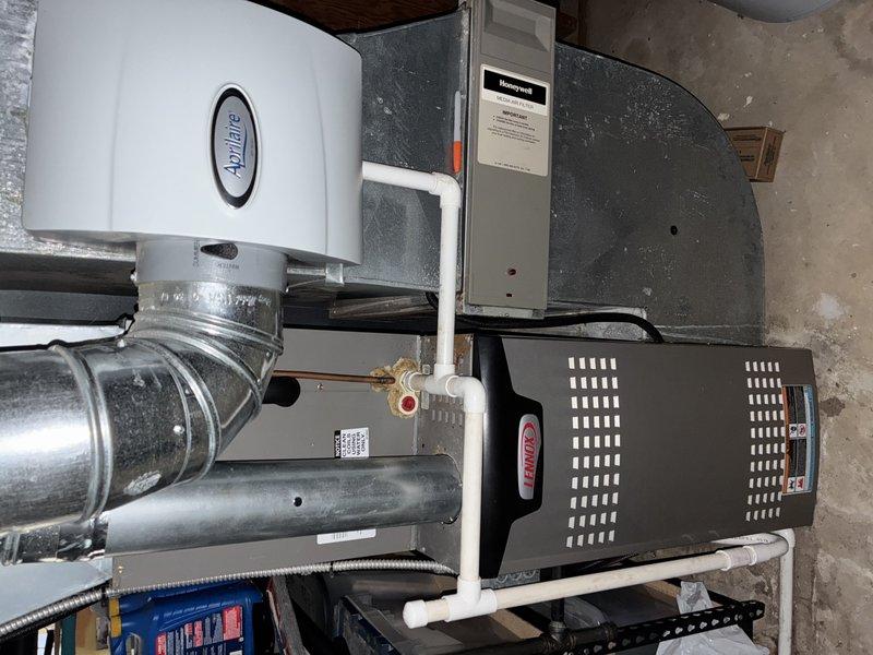 Completed BS-MVP cooling maintenance visit on 9-year-old outdoor air conditioning unit. Performed standard preventive maintenance inspection, verified proper operation of condenser fan motor and blades, and documented system condition with interior HVAC components including air handler, ductwork, and humidifier showing normal wear for age. All equipment functioning within specifications at time of service.