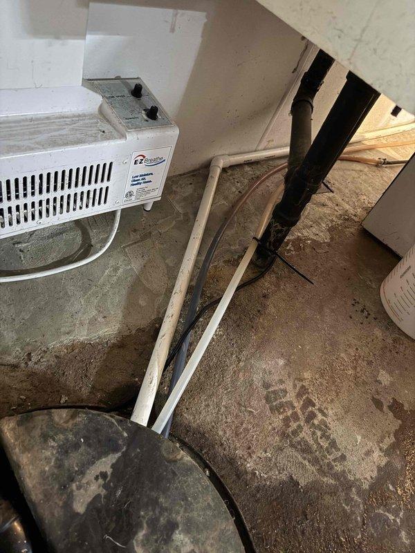Responded to failed inspection due to undersized condensate drain line that was retaining water instead of allowing proper drainage flow. Corrected drain line sizing to meet code requirements and ensure proper water evacuation from the air handler unit, allowing for permit release and inspection approval.