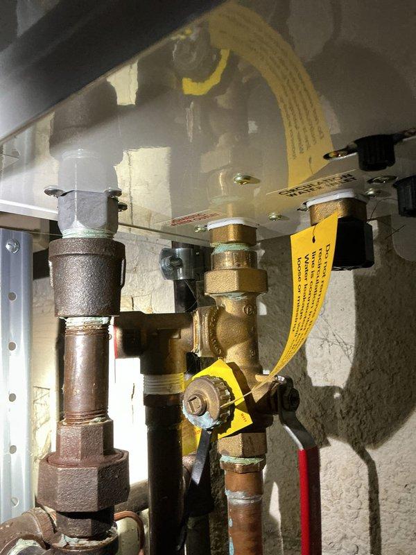 Responded to service call for a 7-year-old Navien natural gas tankless water heater requiring descaling maintenance and gas leak repair. The gas leak had been previously identified by an electrician during a prior visit to the property. Upon arrival, performed thorough inspection of the tankless water heater installation, including all gas supply connections, isolation valves, and piping assembly.

Conducted descaling procedure on the tankless unit to remove mineral buildup and restore optimal heat exchanger performance. Located and identified the gas leak at the connection points serving the tankless water heater. Performed pressure testing on the natural gas supply lines to verify leak location and ensure system integrity. Repaired the gas leak by tightening and resealing the affected brass fittings and connections. Applied leak detection solution to all gas connections to confirm complete seal and absence of additional leaks.

Re-tested the gas pressure throughout the system followi