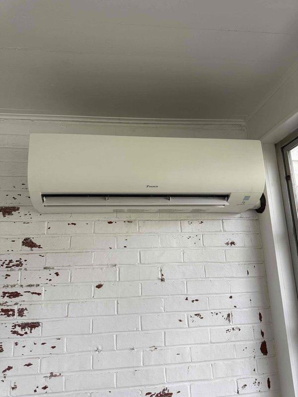Responded to service call for non-operational Daikin mini-split system with no cooling. Upon inspection, discovered severe frost and ice buildup on refrigerant lines and valve assembly, indicating a refrigerant restriction or low charge condition causing the evaporator coil to freeze. Contacted technical support for diagnostic assistance, documented conditions with photos, and identified the need for further refrigerant system evaluation and potential leak repair.