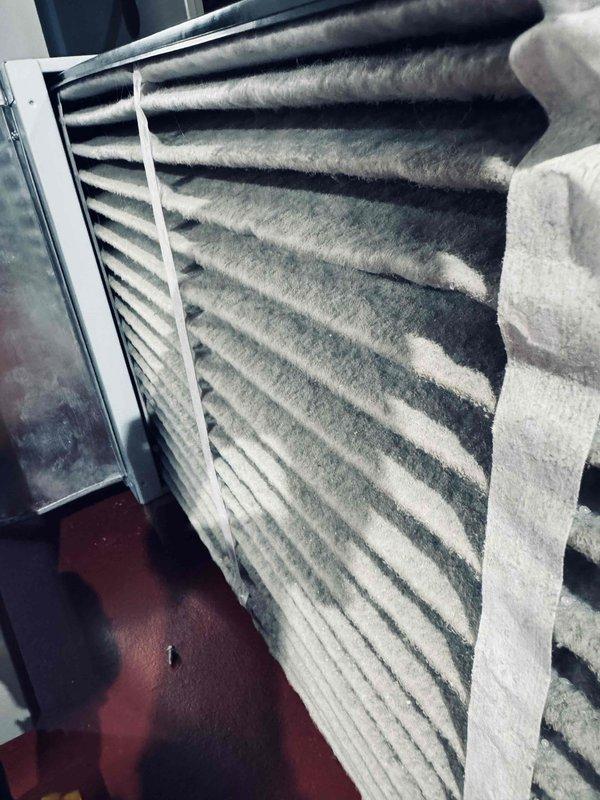 Completed comprehensive air conditioning tune-up on residential system. Upon inspection, discovered evaporator coil assembly heavily contaminated with substantial dust, lint, and debris accumulation that was restricting airflow and reducing system efficiency. Thoroughly cleaned evaporator coils, removing fibrous buildup from all fin surfaces to restore proper heat exchange capability and airflow. Performed standard maintenance procedures including system performance evaluation and safety checks. Installed complimentary carbon monoxide detector for enhanced home safety.