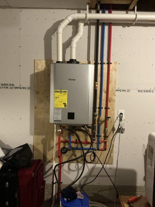 Performed scheduled descaling maintenance on a wall-mounted Rinnai tankless water heater unit. Flushed the heat exchanger with descaling solution to remove mineral buildup and calcium deposits that accumulate over time and reduce heating efficiency. Removed, cleaned, and inspected the inlet water filter screen, which showed moderate sediment accumulation. Verified proper operation of all water connections, gas supply lines, and PVC venting system upon completion. Unit tested and returned to normal service with improved flow rate and optimal performance.