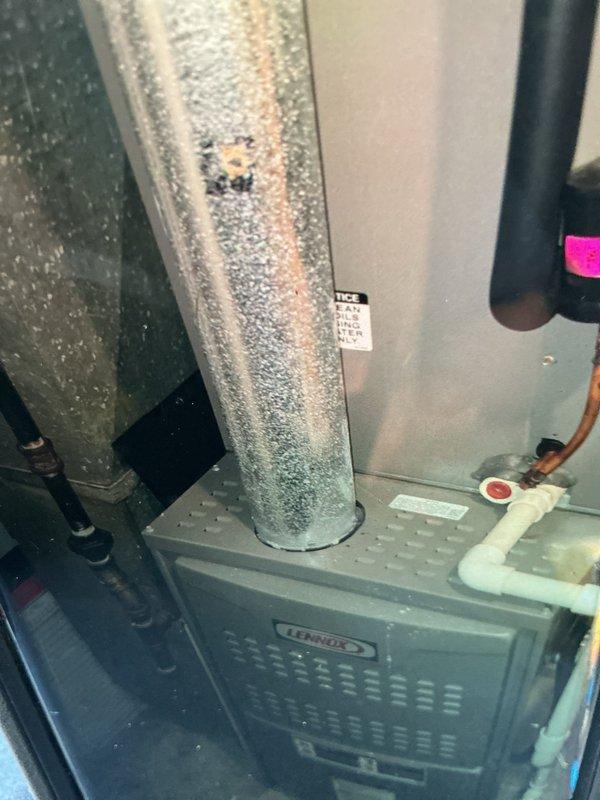 Completed scheduled cooling maintenance visit on Lennox HVAC system. Performed comprehensive inspection of air handler unit, electrical components, and control board. Documented system operation with significant condensation present on vertical ductwork indicating active cooling cycle and proper temperature differential. Verified all electrical connections, control wiring, and safety components functioning within normal parameters.