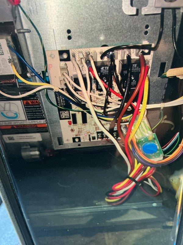 Completed scheduled cooling maintenance visit on Lennox HVAC system. Performed comprehensive inspection of air handler unit, electrical components, and control board. Documented system operation with significant condensation present on vertical ductwork indicating active cooling cycle and proper temperature differential. Verified all electrical connections, control wiring, and safety components functioning within normal parameters.