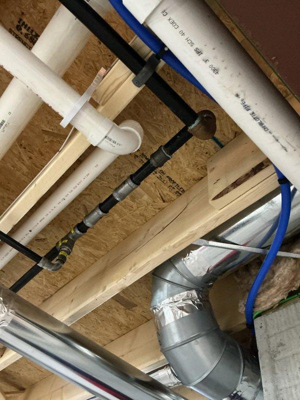 Conducted free estimate for tankless water heater replacement in residential property. Evaluated existing conventional tank water heater and surrounding plumbing infrastructure, including PVC supply lines, PEX tubing, and gas connections in ceiling space. Customer requested assessment for converting current system to tankless unit; existing tank water heater is currently functioning properly without issues.