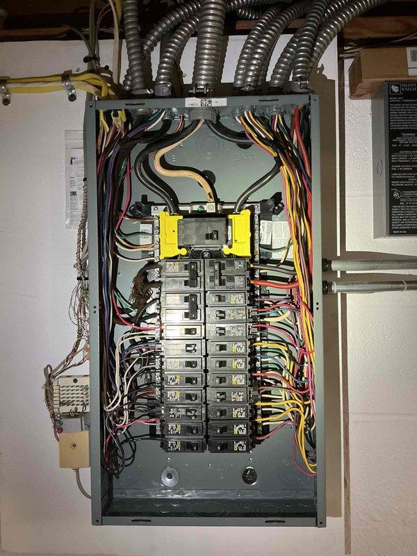Conducted on-site electrical estimate for standby generator installation. Evaluated existing electrical panel configuration and assessed attic space for potential equipment placement and wiring routing. Documented current electrical infrastructure including main service panel with multiple branch circuits to determine integration requirements for either Generac or Kohler generator system with appropriate transfer switch installation.