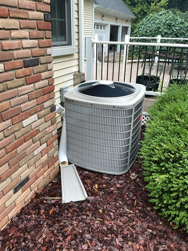 Completed installation of 5-ton air conditioning system with coil replacement. Removed existing furnace, constructed and installed platform stand to elevate unit for proper clearance, then reinstalled furnace and connected new AC system. Replaced corroded electrical fuses during installation to ensure safe operation of outdoor condensing unit.