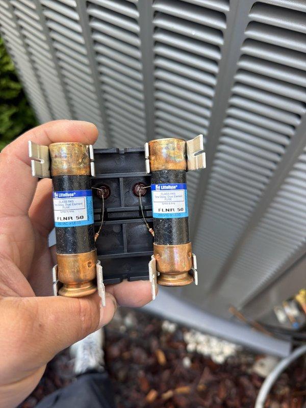 Completed installation of 5-ton air conditioning system with coil replacement. Removed existing furnace, constructed and installed platform stand to elevate unit for proper clearance, then reinstalled furnace and connected new AC system. Replaced corroded electrical fuses during installation to ensure safe operation of outdoor condensing unit.