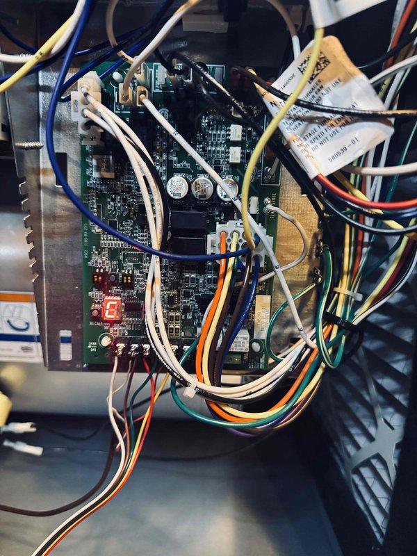 Completed preventive maintenance inspection on cooling system. Performed electrical diagnostics using digital multimeter, verified amperage draw at 941A and voltage readings on system components. Inspected control board assembly, confirmed proper LED indicator function, and verified all wire connections and capacitors secure with no signs of degradation.