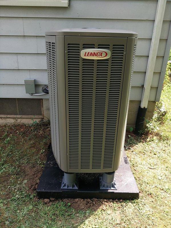 # HVAC Install - Complete System

Completed full system installation including outdoor Lennox heat pump condenser unit, indoor air handler with heat strips located in basement. Positioned condenser on concrete pad against exterior wall with proper clearances, installed electrical disconnect box, and connected refrigerant line set with appropriate insulation. Ran refrigerant lines from outdoor unit through wall penetration to basement air handler location. Installed service valve assembly with gauges at outdoor unit for future maintenance access. Secured all refrigerant lines with proper foam insulation and routing along exterior wall. System installed per manufacturer specifications and ready for startup and commissioning.