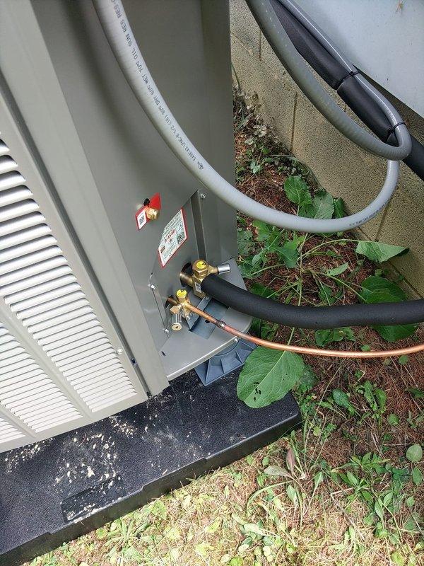 # HVAC Install - Complete System

Completed full system installation including outdoor Lennox heat pump condenser unit, indoor air handler with heat strips located in basement. Positioned condenser on concrete pad against exterior wall with proper clearances, installed electrical disconnect box, and connected refrigerant line set with appropriate insulation. Ran refrigerant lines from outdoor unit through wall penetration to basement air handler location. Installed service valve assembly with gauges at outdoor unit for future maintenance access. Secured all refrigerant lines with proper foam insulation and routing along exterior wall. System installed per manufacturer specifications and ready for startup and commissioning.
