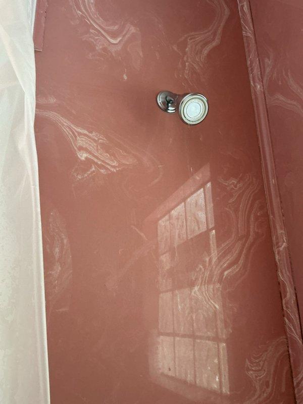 Responded to service call for elderly homeowner with broken shower head and stuck fixture component preventing replacement. Successfully extracted the broken shower head piece that was lodged in the shower arm threading, cleaned the connection point, and installed new shower head to restore functionality to the only operational shower in the residence. Additionally inspected and repaired leaking bathtub faucet, replacing worn internal components to eliminate water waste and restore proper operation.