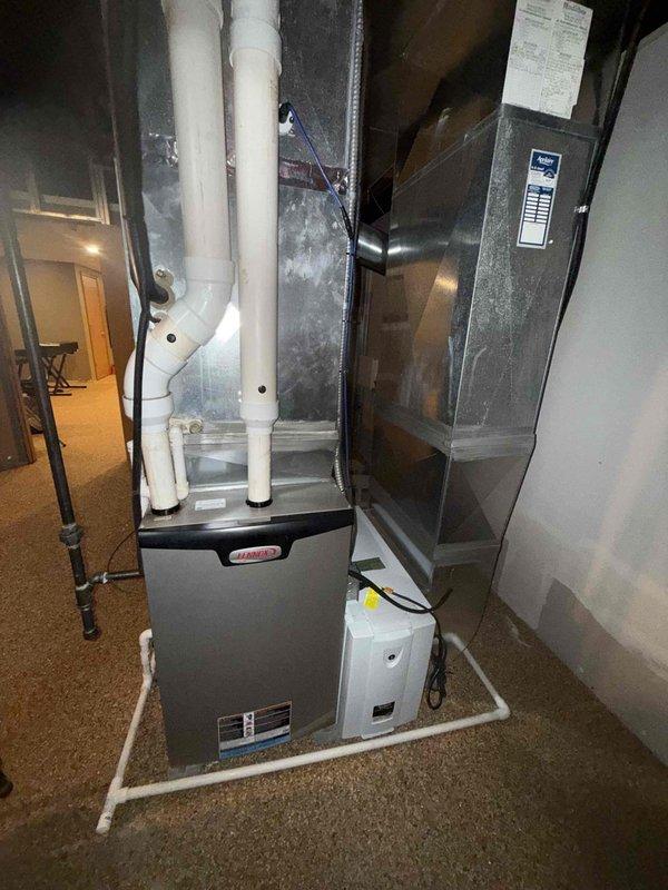 Completed comprehensive AC tune-up on a 9-year-old Lennox system in residential basement installation. Performed full system inspection including refrigerant levels, electrical connections, condensate drain lines, and airflow verification. System tested and confirmed operating properly with all components functioning within manufacturer specifications.