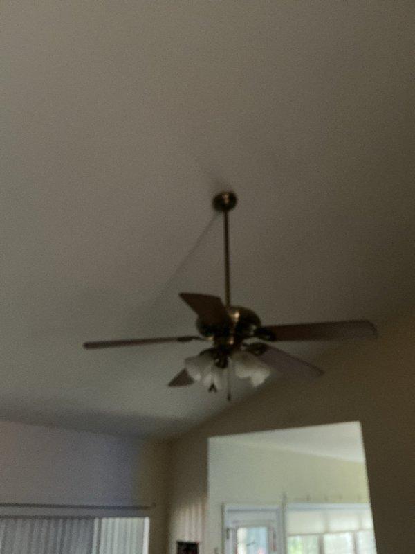 Successfully replaced ceiling fan in residential space with high ceiling installation between 10-12 feet. Removed existing fan unit and installed new Hunter brand ceiling fan using existing wiring and electrical connections, eliminating the need for any new wiring work. Completed installation during standard daytime service window, ensuring proper mounting, blade balance, and light fixture functionality upon completion.