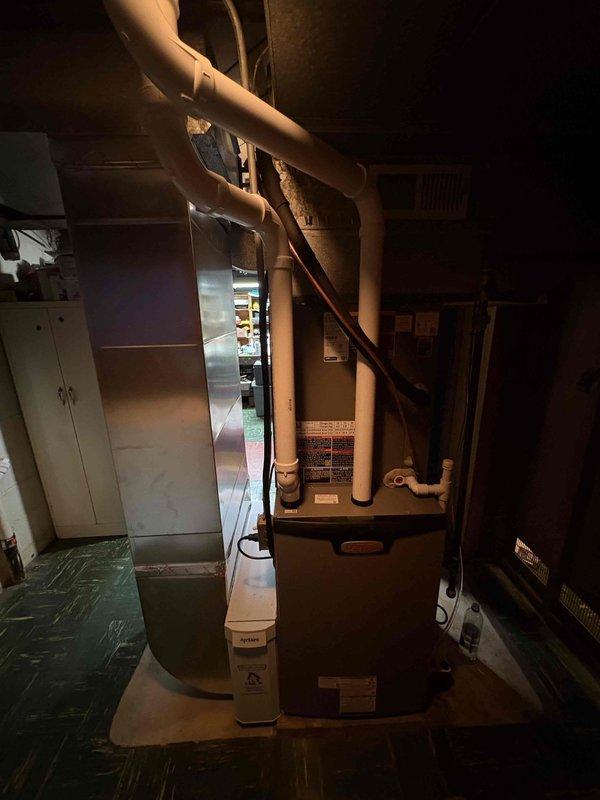 Completed installation of a 90% efficiency furnace and heat pump system with condensate pump. Installed new air handler unit in basement mechanical room with complete ductwork distribution, white PVC condensate drain and vent piping routed through exterior brick wall in Y-configuration for proper drainage and venting. All equipment tested and operational upon completion.