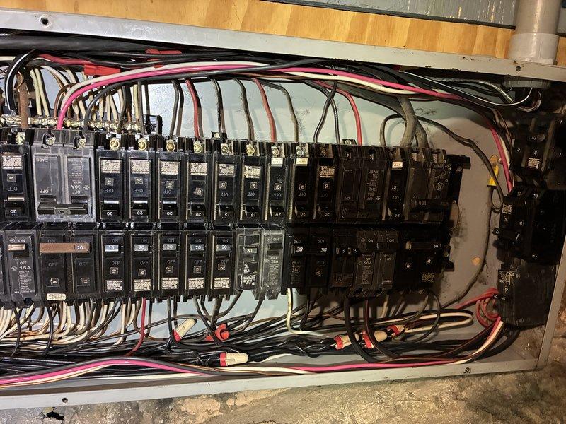 Responded to service call for two air conditioning units repeatedly tripping circuit breakers. Performed comprehensive inspection of electrical panel, identifying overloaded circuits and inadequate breaker sizing for the dual A/C system load demand. Evaluated wire gauge compatibility, verified proper grounding, and assessed overall panel capacity to safely support the existing HVAC equipment under simultaneous operation conditions.