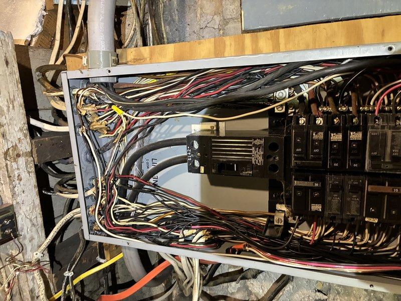 Responded to service call for two air conditioning units repeatedly tripping circuit breakers. Performed comprehensive inspection of electrical panel, identifying overloaded circuits and inadequate breaker sizing for the dual A/C system load demand. Evaluated wire gauge compatibility, verified proper grounding, and assessed overall panel capacity to safely support the existing HVAC equipment under simultaneous operation conditions.