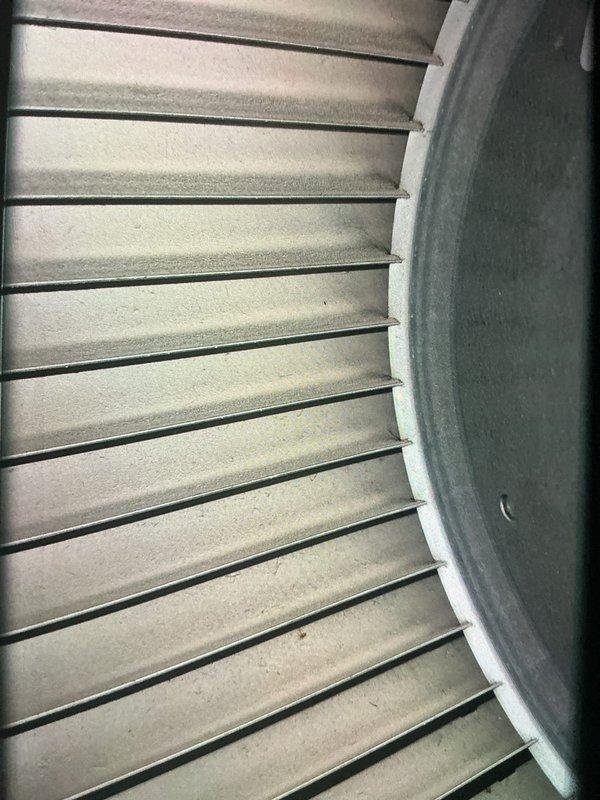 Completed scheduled MVP cooling maintenance visit on 3-year-old system. Performed comprehensive inspection of condenser unit including examination of evaporator coil fins and refrigerant lines. Coil fins showed normal operational dust accumulation with minor discoloration consistent with system age. Verified proper mounting and support components including base pad and leg supports were secure and in good condition. All components functioning within normal parameters with no immediate service needs identified.