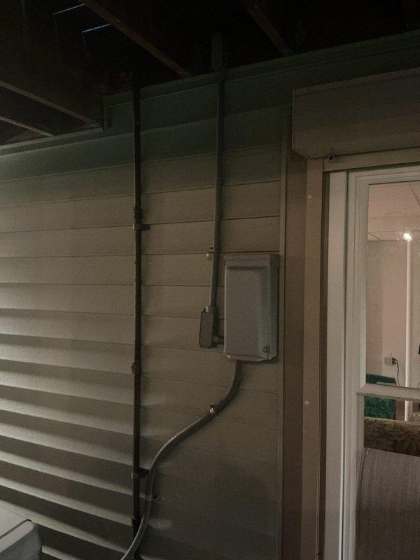 Responded to service call for approximately 20-year-old generator that had not received maintenance in an extended period. Performed visual inspection of generator system, including exterior electrical conduit routing along building exterior and automatic transfer switch/emergency load center. Documented existing installation configuration with particular attention to current generator location, as customer has requested unit relocation due to planned new patio installation. Assessed electrical connections, transfer switch operation, and circuit distribution to determine feasibility and requirements for future relocation project.