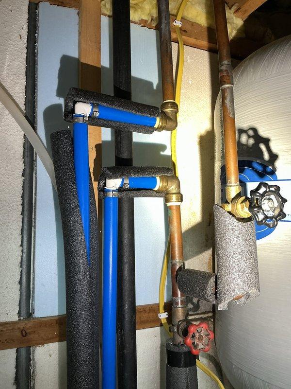 Conducted on-site assessment for water softener replacement in residential property. Evaluated existing 10+ year old water softener system and surrounding plumbing infrastructure, including PEX supply lines, copper piping, shut-off valves, and connection points. Documented current installation configuration with existing valve assembly showing signs of age and corrosion. Photographed plumbing layout in utility area to determine specifications for new water softener installation, noting pipe materials, fitting locations, and available space for equipment placement. Provided comprehensive free quote for complete water softener replacement based on existing plumbing conditions and customer requirements.