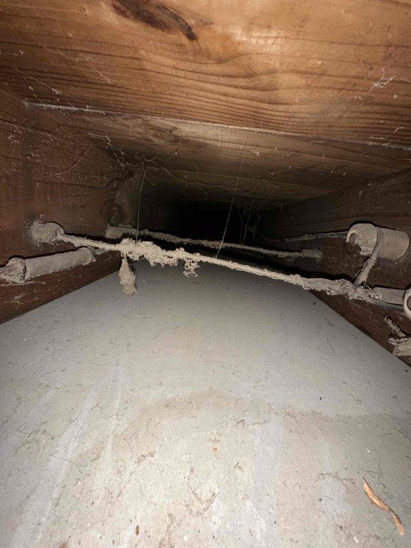Completed indoor air quality installation in crawl space area involving flexible ductwork assembly and connection points. Installed and secured metallic ribbed flexible duct with proper mounting flanges to existing HVAC distribution system, ensuring proper airflow to multiple vents throughout the structure. Work performed in under-floor crawl space with coordination for site access and confirmation upon arrival.