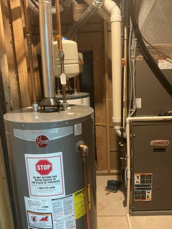 Responded to service call regarding low hot water pressure issues at 15-year-old residential property. Upon inspection, evaluated existing Rheem tanked gas water heater with EverKleen and Guardian System features. Assessed water heater performance, pressure relief valve operation, and internal sediment accumulation affecting hot water flow. Determined unit was functioning within acceptable parameters but showing age-related efficiency decline. Discussed repair versus replacement options with homeowner, considering equipment age and cost-effectiveness of continued repairs. Documented existing installation including expansion tank, flue venting, and connection to adjacent Lennox furnace system. Provided recommendations for addressing pressure concerns and future equipment planning.