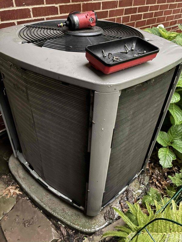 Performed comprehensive AC tune-up on outdoor condenser unit, including removal and cleaning of heavily soiled exterior panels caked with dirt, organic debris, and mildew buildup. Inspected internal components, cleaned fan assembly, and verified proper system operation. Provided complimentary carbon monoxide detector as part of seasonal maintenance service.