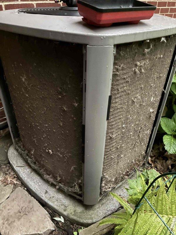 Performed comprehensive AC tune-up on outdoor condenser unit, including removal and cleaning of heavily soiled exterior panels caked with dirt, organic debris, and mildew buildup. Inspected internal components, cleaned fan assembly, and verified proper system operation. Provided complimentary carbon monoxide detector as part of seasonal maintenance service.