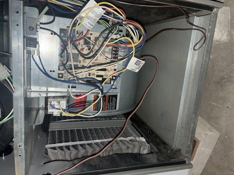 Completed MVP cooling maintenance visit on 4-year-old system. Performed comprehensive inspection of outdoor condensing unit and indoor air handler components. Inspected electrical connections, control board wiring, and verified proper wire routing throughout system. Examined and documented dual 35A TRS2R fuses rated at 600VAC in fuse holder assembly, confirming proper amperage protection. Noted weathered copper refrigerant lines showing normal patina consistent with unit age and outdoor exposure. Verified filter condition and accessibility. All electrical connections found secure with proper color-coded wiring to control board. System operational with no immediate service needs identified during this routine maintenance inspection.