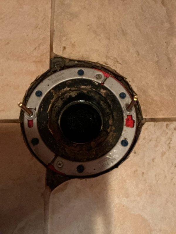 Replaced the master bathroom toilet with a new American Standard Cadet Pro elongated model featuring a slow-close seat. Removed the existing corroded metal closet flange and installed a new clam-style flange to ensure proper sealing and secure mounting. The old flange exhibited significant rust and corrosion from water exposure, requiring complete replacement to prevent future leaks and ensure stable toilet installation.