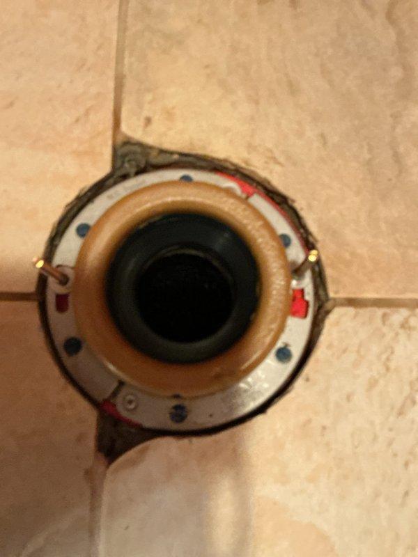 Replaced the master bathroom toilet with a new American Standard Cadet Pro elongated model featuring a slow-close seat. Removed the existing corroded metal closet flange and installed a new clam-style flange to ensure proper sealing and secure mounting. The old flange exhibited significant rust and corrosion from water exposure, requiring complete replacement to prevent future leaks and ensure stable toilet installation.