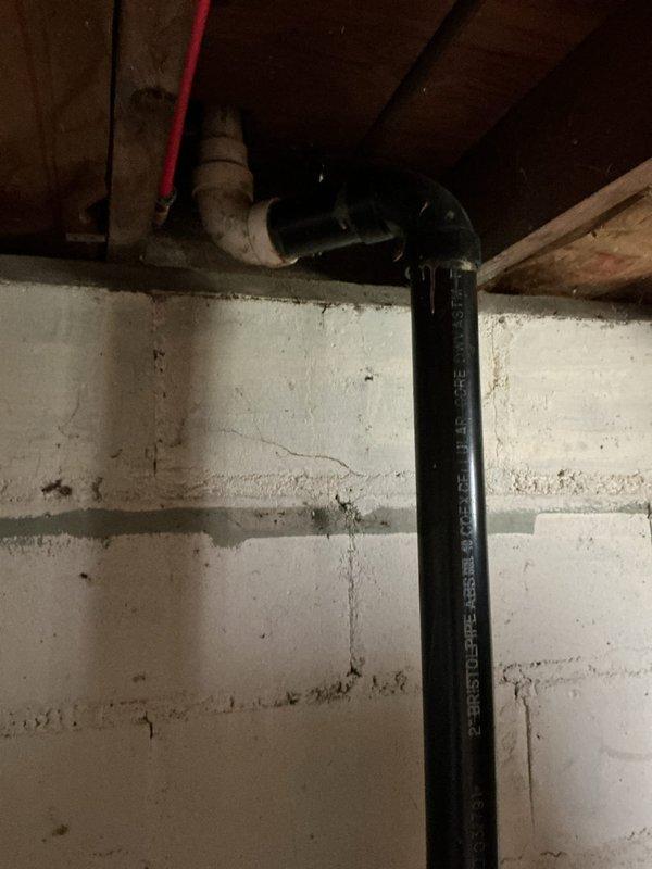 Responded to service call for slow-draining kitchen sink. Upon inspection, accessed basement plumbing system beneath kitchen area and identified drainage issue in the waste line. Cleared obstruction from kitchen drain line using appropriate methods. Inspected utility sink plumbing connections and verified proper drainage flow through PVC trap assembly and waste pipes. Tested kitchen drain operation to confirm restoration of normal flow rate and verified no leaks at connection points in basement piping system.