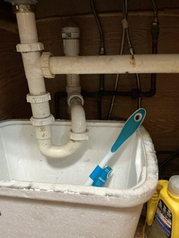 Responded to service call for slow-draining kitchen sink. Upon inspection, accessed basement plumbing system beneath kitchen area and identified drainage issue in the waste line. Cleared obstruction from kitchen drain line using appropriate methods. Inspected utility sink plumbing connections and verified proper drainage flow through PVC trap assembly and waste pipes. Tested kitchen drain operation to confirm restoration of normal flow rate and verified no leaks at connection points in basement piping system.